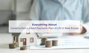 Miniature house model with stacked coins on a table, symbolizing property investment and Construction-Linked Payment Plan (CLP) in real estate, with a person reviewing documents in the background.